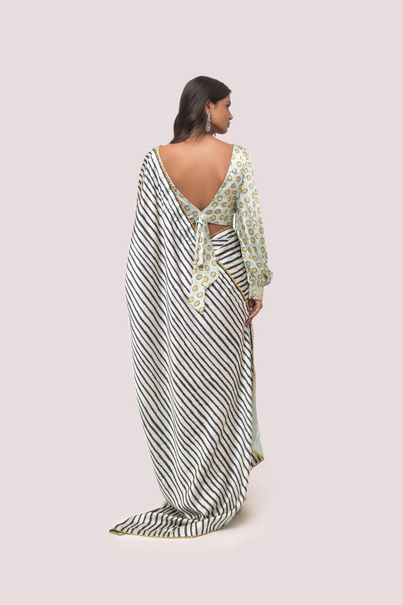 Shop white and black stripes satin saree online in USA with mint green blouse. Make a fashion statement on festive occasions and weddings with designer sarees, designer suits, Indian dresses, Anarkali suits, palazzo suits, designer gowns, sharara suits, embroidered sarees from Pure Elegance Indian fashion store in USA.-back