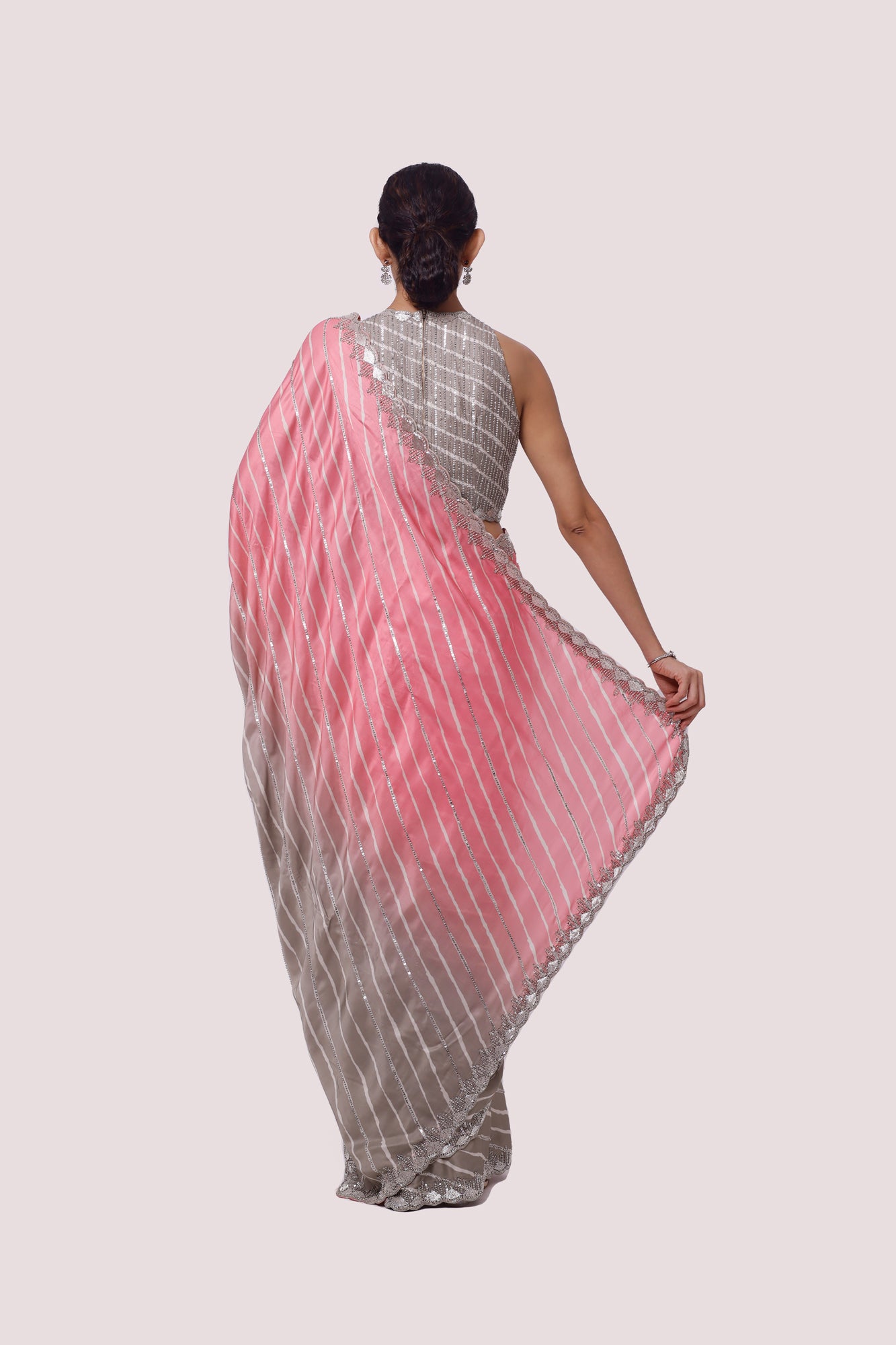 Shop ash grey and pink embellished satin saree online in USA with blouse. Make a fashion statement on festive occasions and weddings with designer sarees, designer suits, Indian dresses, Anarkali suits, palazzo suits, designer gowns, sharara suits, embroidered sarees from Pure Elegance Indian fashion store in USA.-back