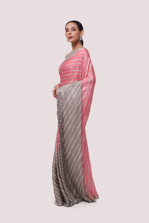 Shop ash grey and pink embellished satin saree online in USA with blouse. Make a fashion statement on festive occasions and weddings with designer sarees, designer suits, Indian dresses, Anarkali suits, palazzo suits, designer gowns, sharara suits, embroidered sarees from Pure Elegance Indian fashion store in USA.-pallu