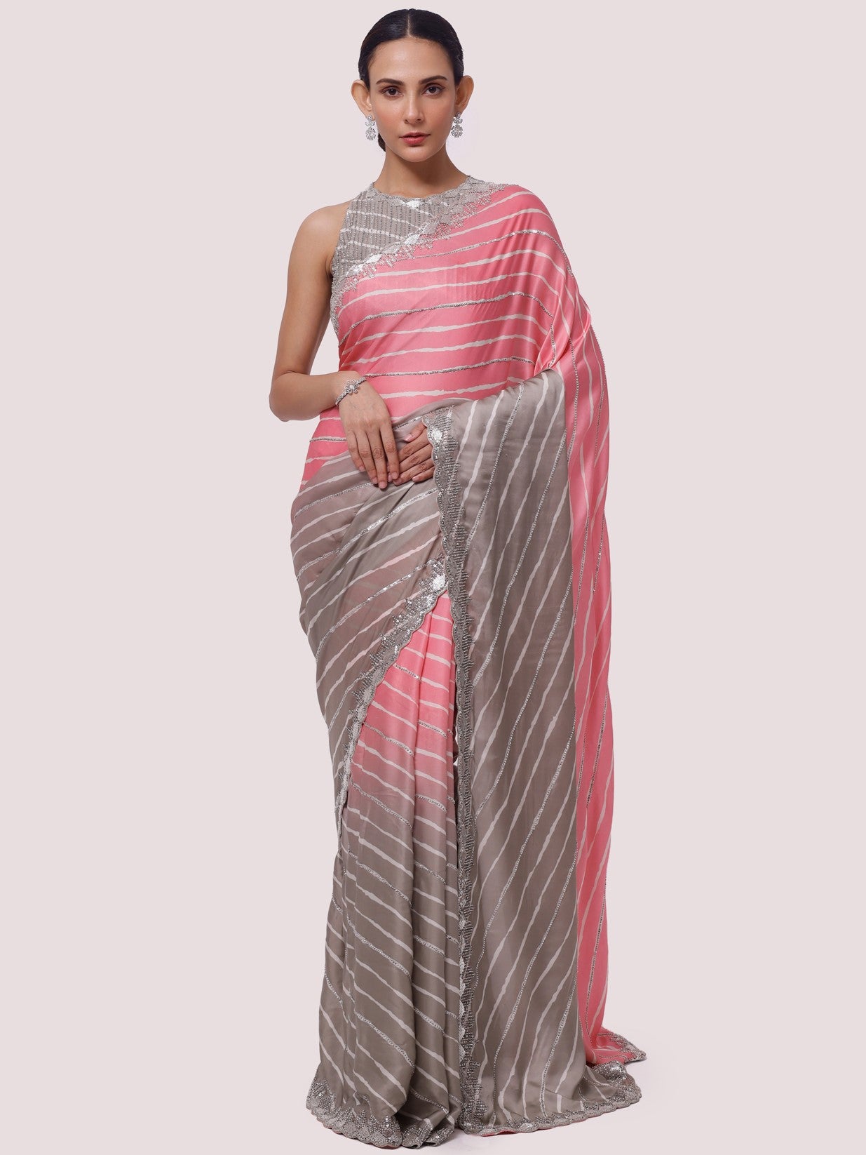 Shop ash grey and pink embellished satin saree online in USA with blouse. Make a fashion statement on festive occasions and weddings with designer sarees, designer suits, Indian dresses, Anarkali suits, palazzo suits, designer gowns, sharara suits, embroidered sarees from Pure Elegance Indian fashion store in USA.-full view