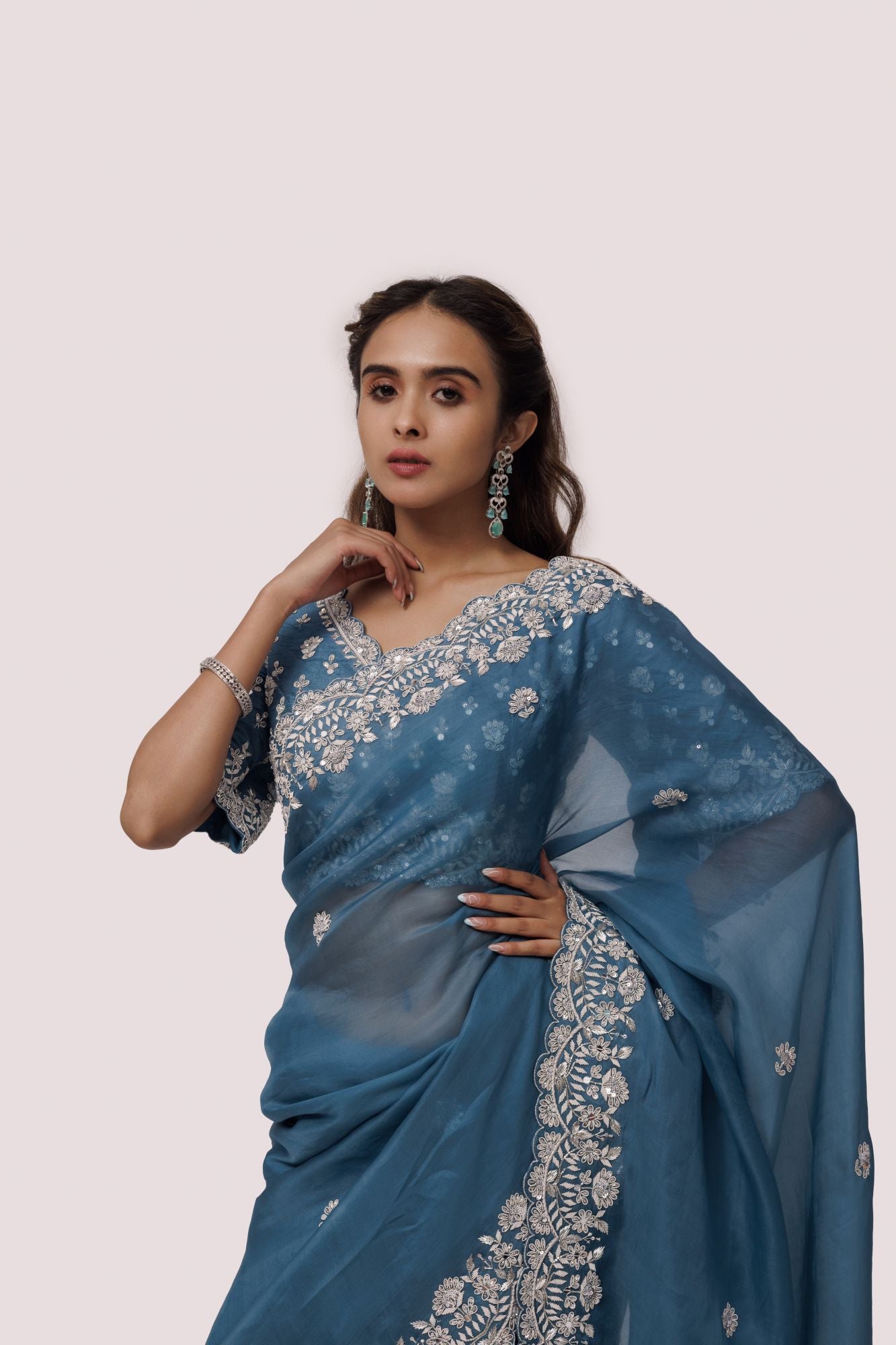 Shop sea blue embroidered organza satin saree online in USA with blouse. Make a fashion statement on festive occasions and weddings with designer sarees, designer suits, Indian dresses, Anarkali suits, palazzo suits, designer gowns, sharara suits, embroidered sarees from Pure Elegance Indian fashion store in USA.-closeup