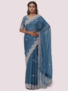 Shop sea blue embroidered organza satin saree online in USA with blouse. Make a fashion statement on festive occasions and weddings with designer sarees, designer suits, Indian dresses, Anarkali suits, palazzo suits, designer gowns, sharara suits, embroidered sarees from Pure Elegance Indian fashion store in USA.-full view