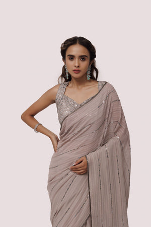 Buy steel grey sequin and cutdana work chikan saree online in USA with blouse. Make a fashion statement on festive occasions and weddings with designer sarees, designer suits, Indian dresses, Anarkali suits, palazzo suits, designer gowns, sharara suits, embroidered sarees from Pure Elegance Indian fashion store in USA.-closeup
