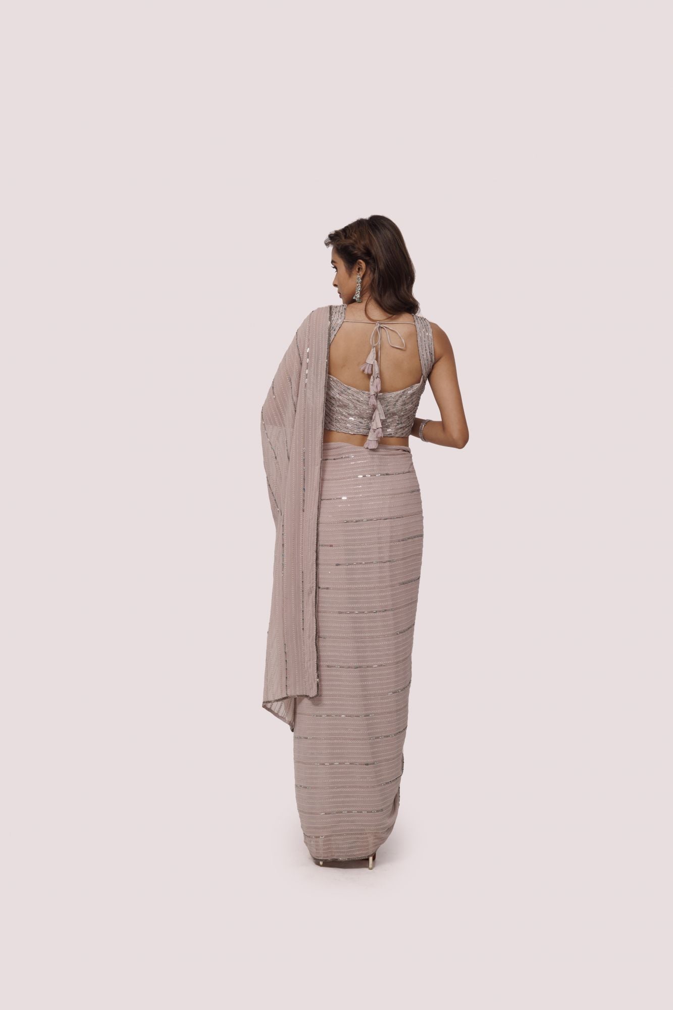 Buy steel grey sequin and cutdana work chikan saree online in USA with blouse. Make a fashion statement on festive occasions and weddings with designer sarees, designer suits, Indian dresses, Anarkali suits, palazzo suits, designer gowns, sharara suits, embroidered sarees from Pure Elegance Indian fashion store in USA.-back