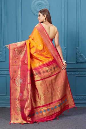 Buy orange Gadhwal silk saree online in USA with pink golden zari border. Look your best on festive occasions in latest designer sarees, pure silk saris, Kanchipuram silk sarees, handwoven sarees, tussar silk sarees, embroidered saris from Pure Elegance Indian clothing store in USA.-back