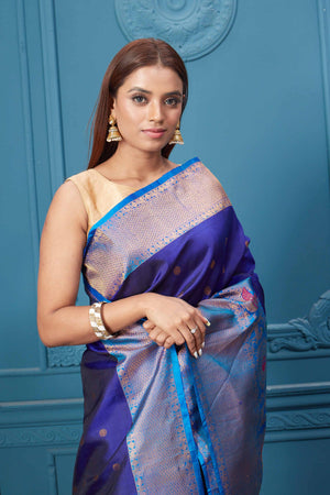 Shop royal blue Gadhwal silk saree online in USA with antique golden border. Look your best on festive occasions in latest designer sarees, pure silk saris, Kanchipuram silk sarees, handwoven sarees, tussar silk sarees, embroidered saris from Pure Elegance Indian clothing store in USA.-closeup