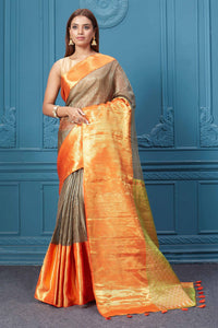 Buy brown striped Kora Kanjivaram saree online in USA with orange border. Look your best on festive occasions in latest designer sarees, pure silk saris, Kanchipuram silk sarees, handwoven sarees, tussar silk sarees, embroidered saris from Pure Elegance Indian clothing store in USA.-full view