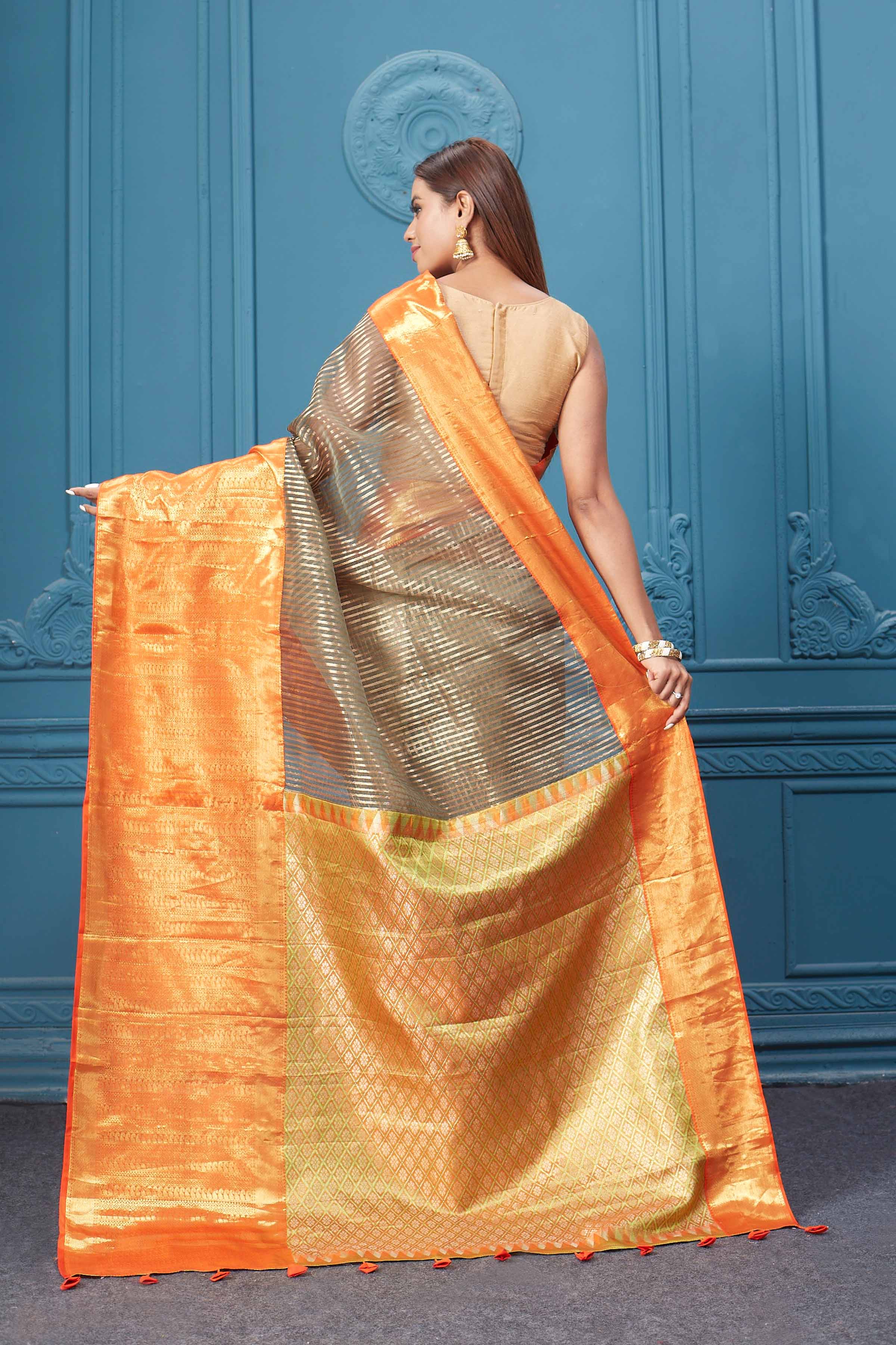 Buy brown striped Kora Kanjivaram saree online in USA with orange border. Look your best on festive occasions in latest designer sarees, pure silk saris, Kanchipuram silk sarees, handwoven sarees, tussar silk sarees, embroidered saris from Pure Elegance Indian clothing store in USA.-back