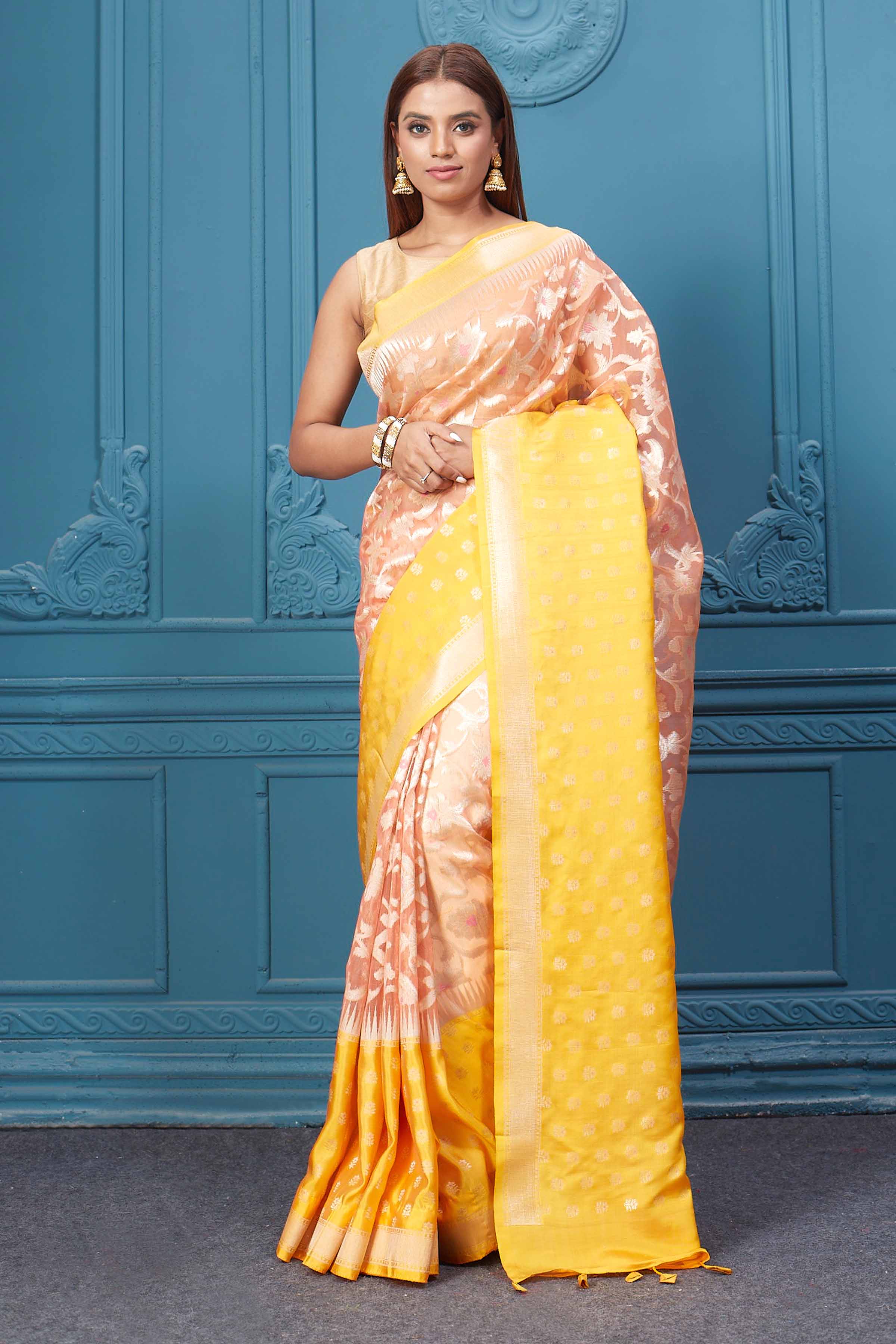 Buy peach fancy Kora sari online in USA with yellow border. Look your best on festive occasions in latest designer sarees, pure silk saris, Kanchipuram silk sarees, handwoven sarees, tussar silk sarees, embroidered saris from Pure Elegance Indian clothing store in USA.-full view
