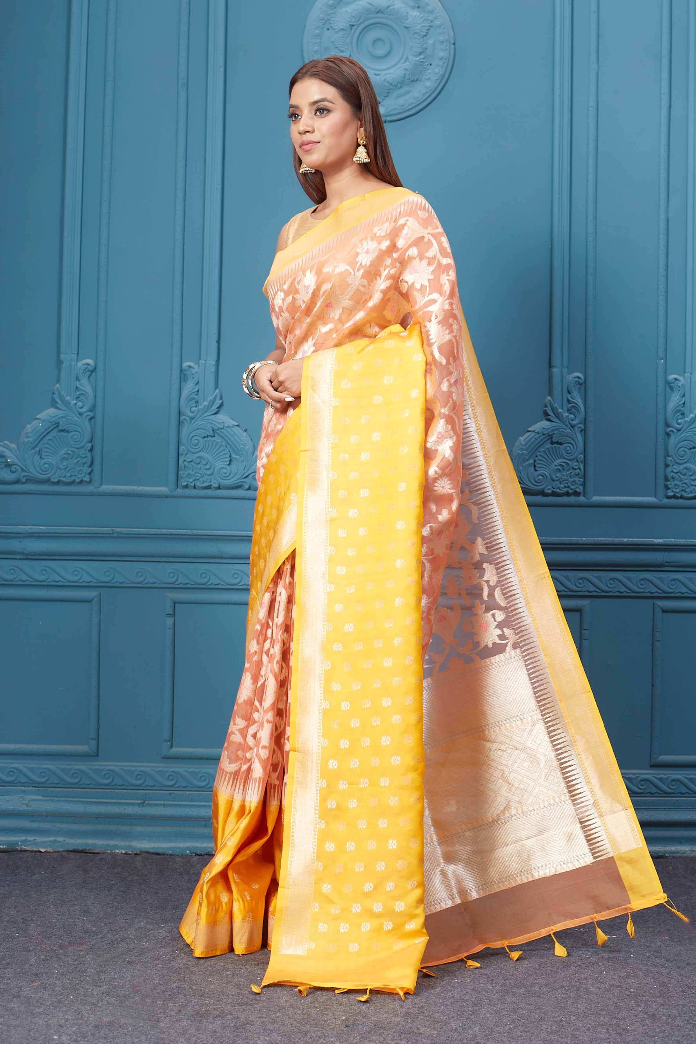 Buy peach fancy Kora sari online in USA with yellow border. Look your best on festive occasions in latest designer sarees, pure silk saris, Kanchipuram silk sarees, handwoven sarees, tussar silk sarees, embroidered saris from Pure Elegance Indian clothing store in USA.-pallu