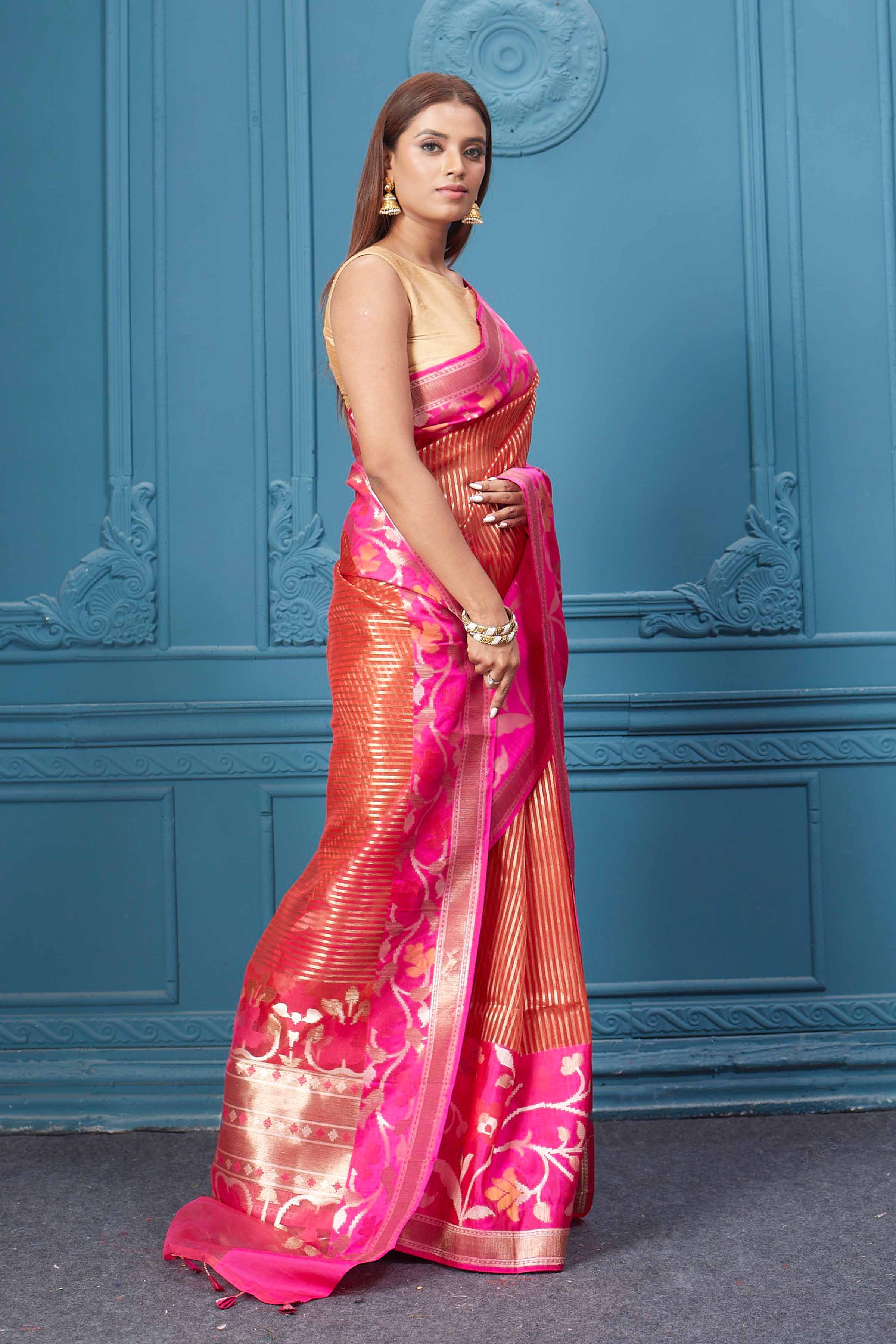 Shop red striped fancy Kora sari online in USA with pink floral border. Look your best on festive occasions in latest designer sarees, pure silk saris, Kanchipuram silk sarees, handwoven sarees, tussar silk sarees, embroidered saris from Pure Elegance Indian clothing store in USA.-side