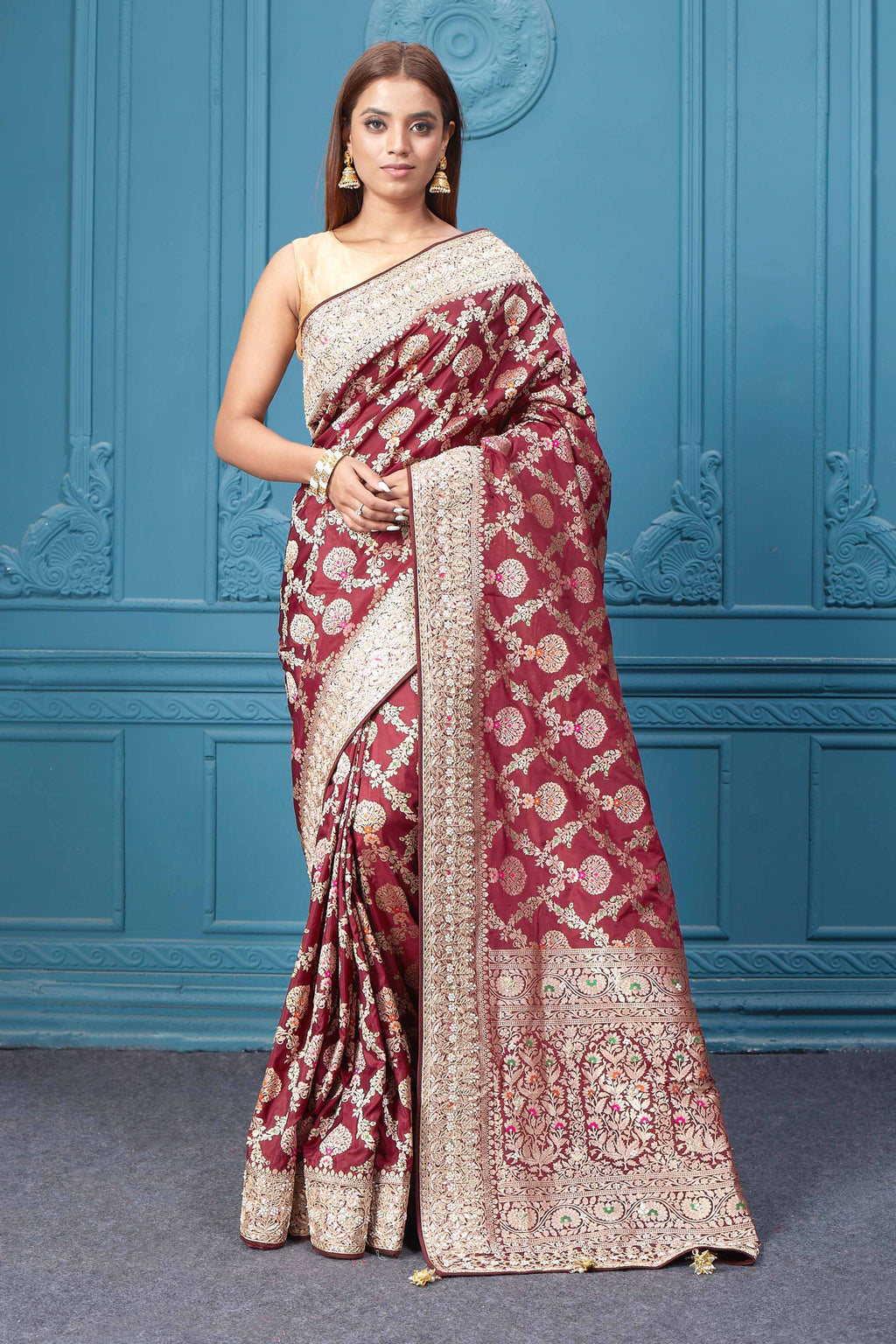 Shop stunning maroon heavy Banarasi silk saree online in USA. Look royal at weddings and festive occasions in exquisite designer sarees, handwoven sarees, pure silk saris, Banarasi sarees, Kanchipuram silk sarees from Pure Elegance Indian saree store in USA. -full view