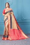 Buy beige Patola silk saree online in USA with embroidered saree blouse. Look royal at weddings and festive occasions in exquisite designer sarees, handwoven sarees, pure silk saris, Banarasi sarees, Kanchipuram silk sarees from Pure Elegance Indian saree store in USA. -full view