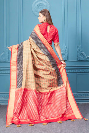 Buy beige Patola silk saree online in USA with embroidered saree blouse. Look royal at weddings and festive occasions in exquisite designer sarees, handwoven sarees, pure silk saris, Banarasi sarees, Kanchipuram silk sarees from Pure Elegance Indian saree store in USA. -back