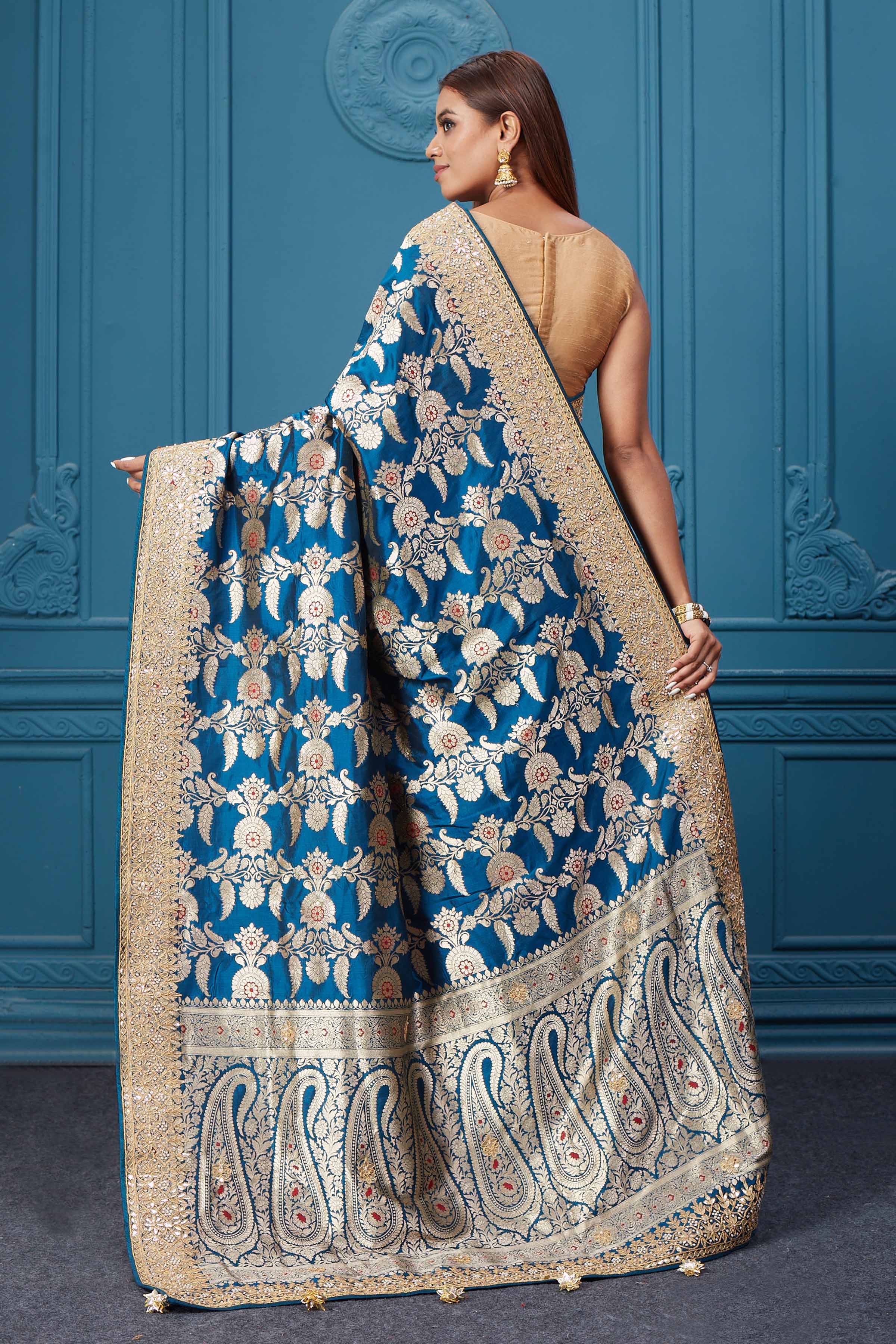 Buy sea blue Banarasi silk sari online in USA with zari minakari work. Look royal at weddings and festive occasions in exquisite designer sarees, handwoven sarees, pure silk saris, Banarasi sarees, Kanchipuram silk sarees from Pure Elegance Indian saree store in USA. -back