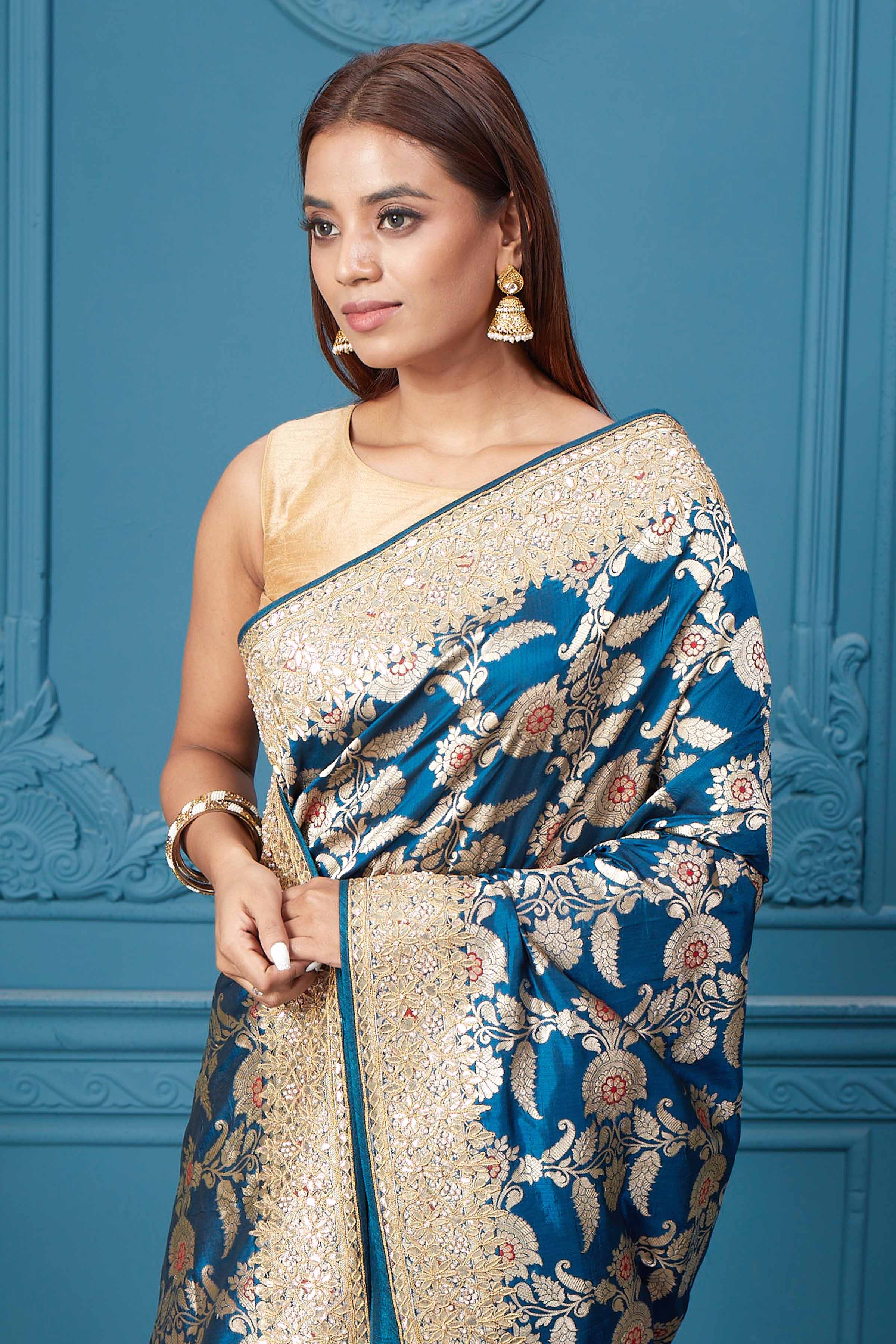Buy sea blue Banarasi silk sari online in USA with zari minakari work. Look royal at weddings and festive occasions in exquisite designer sarees, handwoven sarees, pure silk saris, Banarasi sarees, Kanchipuram silk sarees from Pure Elegance Indian saree store in USA. -closeup