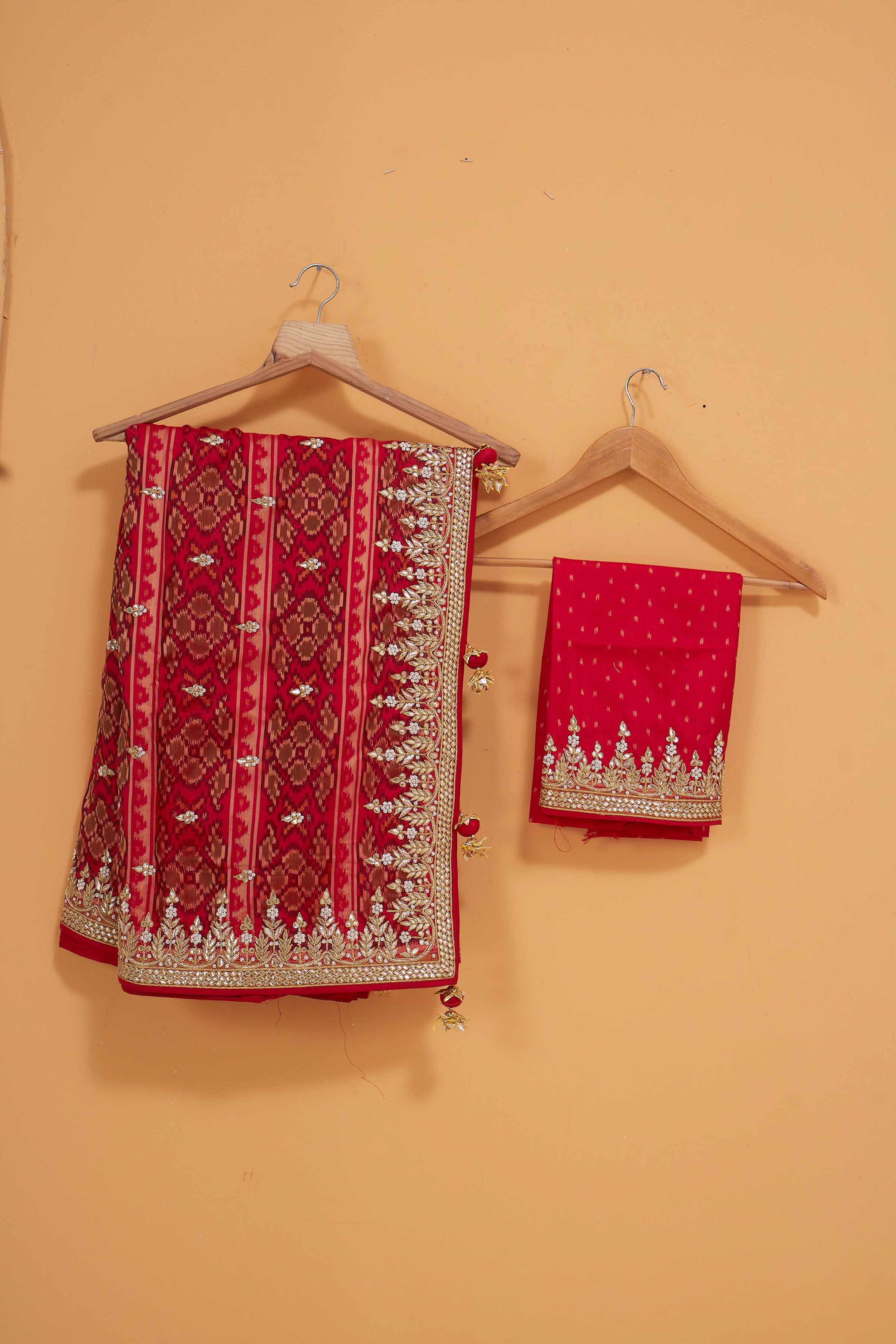 Shop stunning red embroidered Patola silk sari online in USA. Look royal at weddings and festive occasions in exquisite designer sarees, handwoven sarees, pure silk saris, Banarasi sarees, Kanchipuram silk sarees from Pure Elegance Indian saree store in USA. -blouse