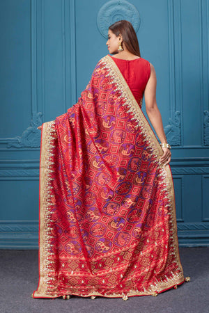 Shop stunning red embroidered Patola silk sari online in USA. Look royal at weddings and festive occasions in exquisite designer sarees, handwoven sarees, pure silk saris, Banarasi sarees, Kanchipuram silk sarees from Pure Elegance Indian saree store in USA. -back
