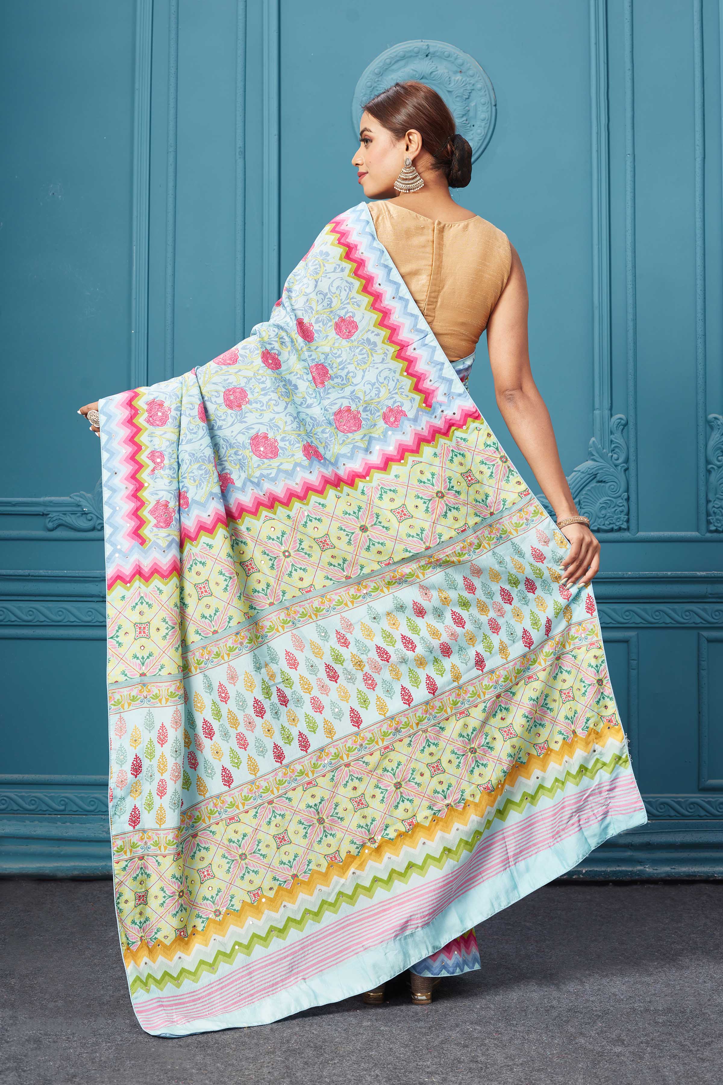 Shop powder blue floral embroidered mulberry silk saree online in USA. Look royal at weddings and festive occasions in exquisite designer sarees, handwoven sarees, pure silk saris, Banarasi sarees, Kanchipuram silk sarees from Pure Elegance Indian saree store in USA. -back