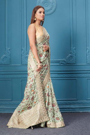 Buy sage green printed and embroidered crepe silk sari online in USA with saree blouse. Look royal at weddings and festive occasions in exquisite designer sarees, handwoven sarees, pure silk saris, Banarasi sarees, Kanchipuram silk sarees from Pure Elegance Indian saree store in USA. -side