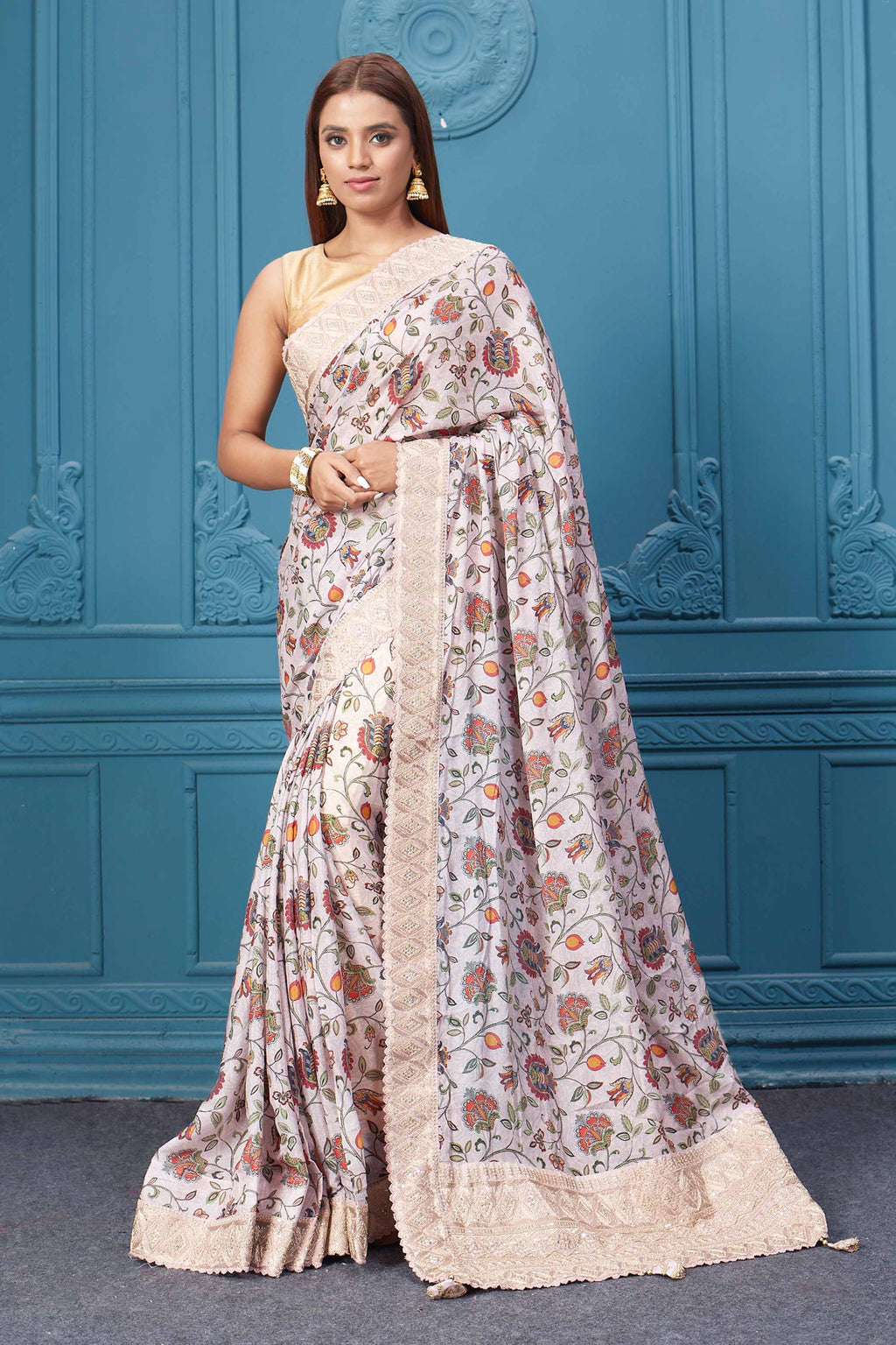 Shop powder pink floral crepe silk sari online in USA with saree blouse. Look royal at weddings and festive occasions in exquisite designer sarees, handwoven sarees, pure silk saris, Banarasi sarees, Kanchipuram silk sarees from Pure Elegance Indian saree store in USA. -full view