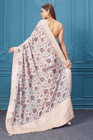 Shop powder pink floral crepe silk sari online in USA with saree blouse. Look royal at weddings and festive occasions in exquisite designer sarees, handwoven sarees, pure silk saris, Banarasi sarees, Kanchipuram silk sarees from Pure Elegance Indian saree store in USA. -back