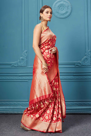Buy red Katan silk Banarasi saree online in USA with floral zari jaal. Keep your ethnic wardrobe up to date with latest designer saris, pure silk sarees, Kanchipuram silk sarees, handwoven silk sarees, tussar silk sarees, embroidered sarees from Pure Elegance Indian saree store in USA.-side