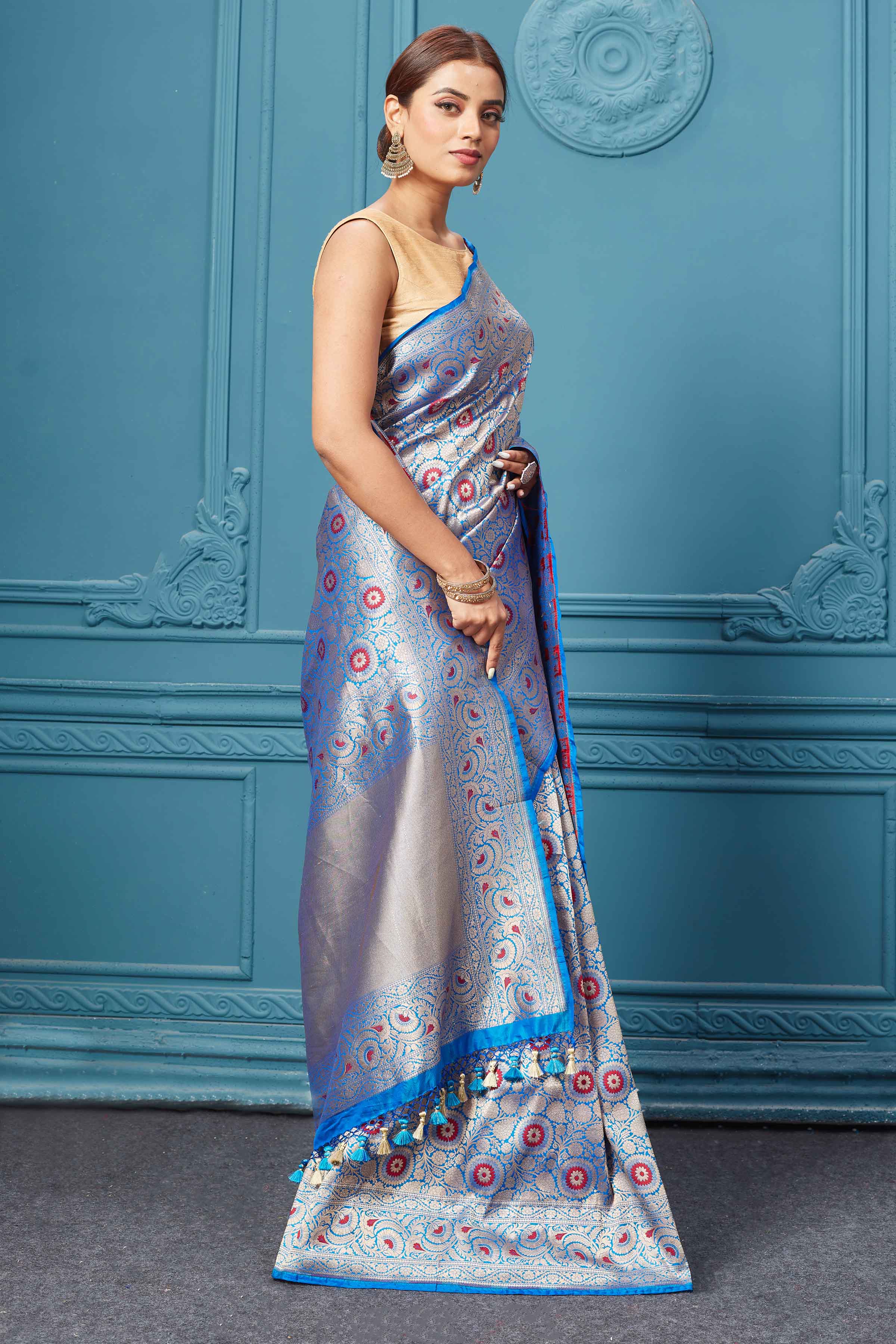 Shop blue Katan silk Banarasi sari online in USA with zari minakari jaal. Keep your ethnic wardrobe up to date with latest designer saris, pure silk sarees, Kanchipuram silk sarees, handwoven silk sarees, tussar silk sarees, embroidered sarees from Pure Elegance Indian saree store in USA.-side