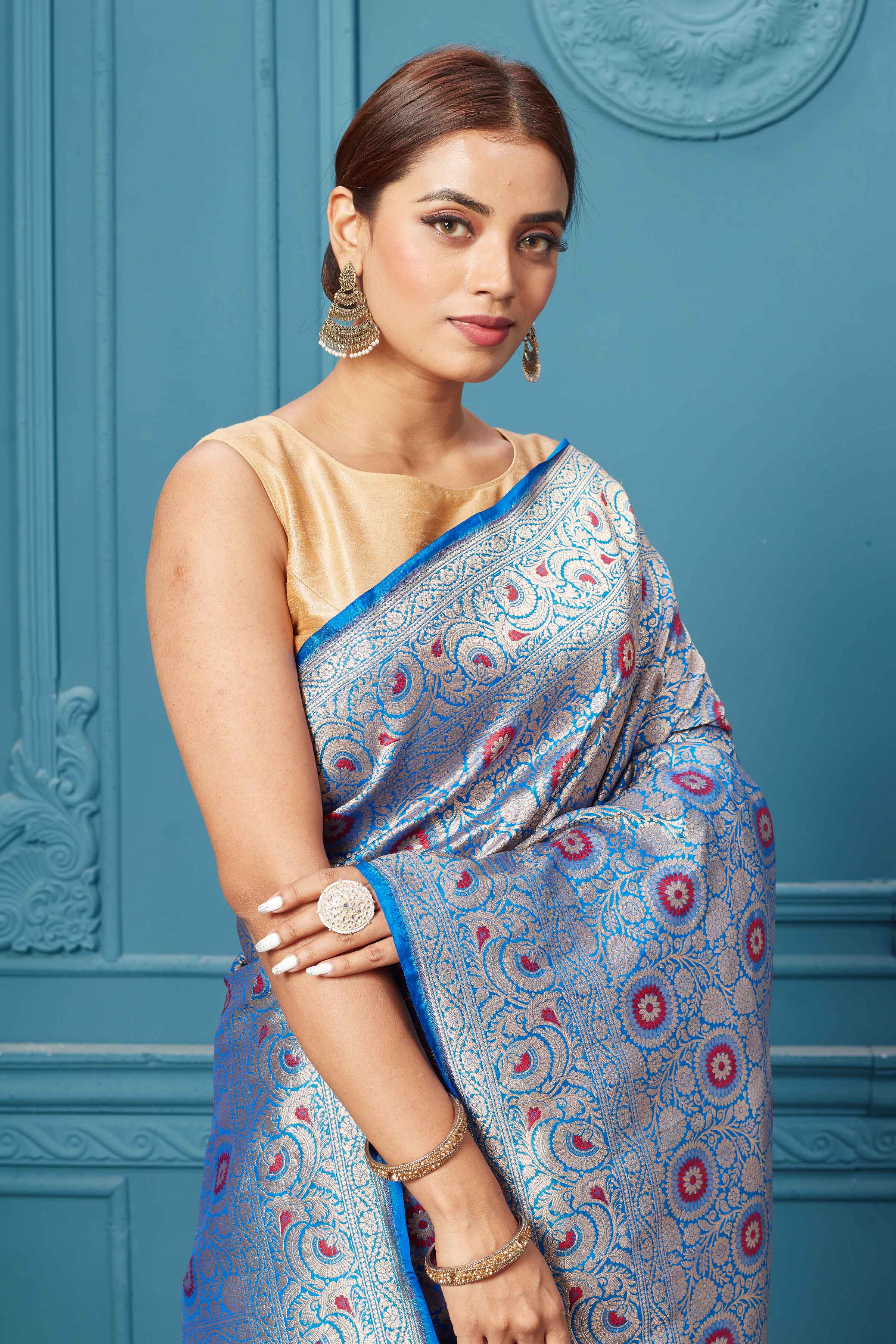 Shop blue Katan silk Banarasi sari online in USA with zari minakari jaal. Keep your ethnic wardrobe up to date with latest designer saris, pure silk sarees, Kanchipuram silk sarees, handwoven silk sarees, tussar silk sarees, embroidered sarees from Pure Elegance Indian saree store in USA.-closeup