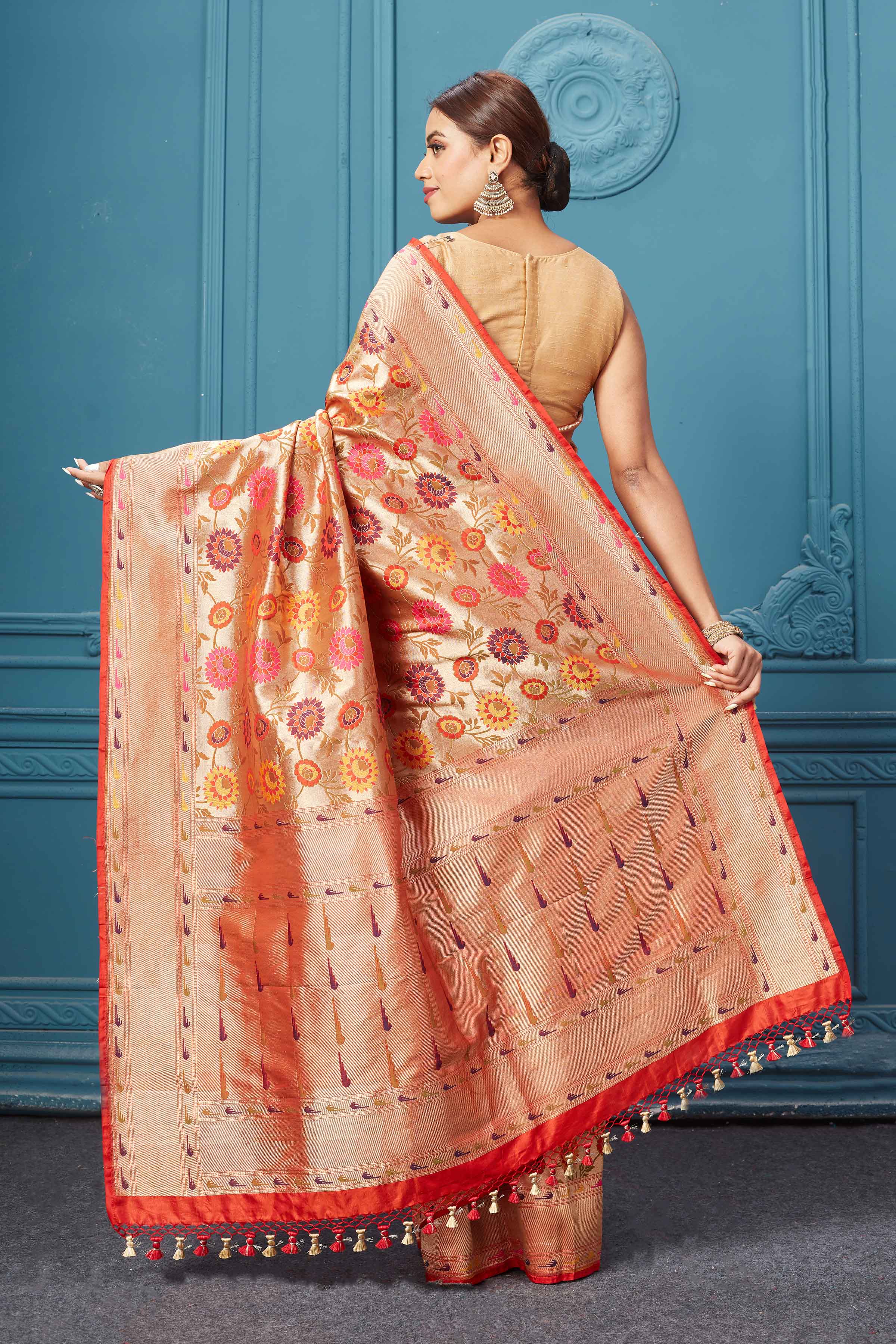 Shop golden Katan silk Banarasi sari online in USA with floral jaal. Keep your ethnic wardrobe up to date with latest designer saris, pure silk sarees, Kanchipuram silk sarees, handwoven silk sarees, tussar silk sarees, embroidered sarees from Pure Elegance Indian saree store in USA.-back
