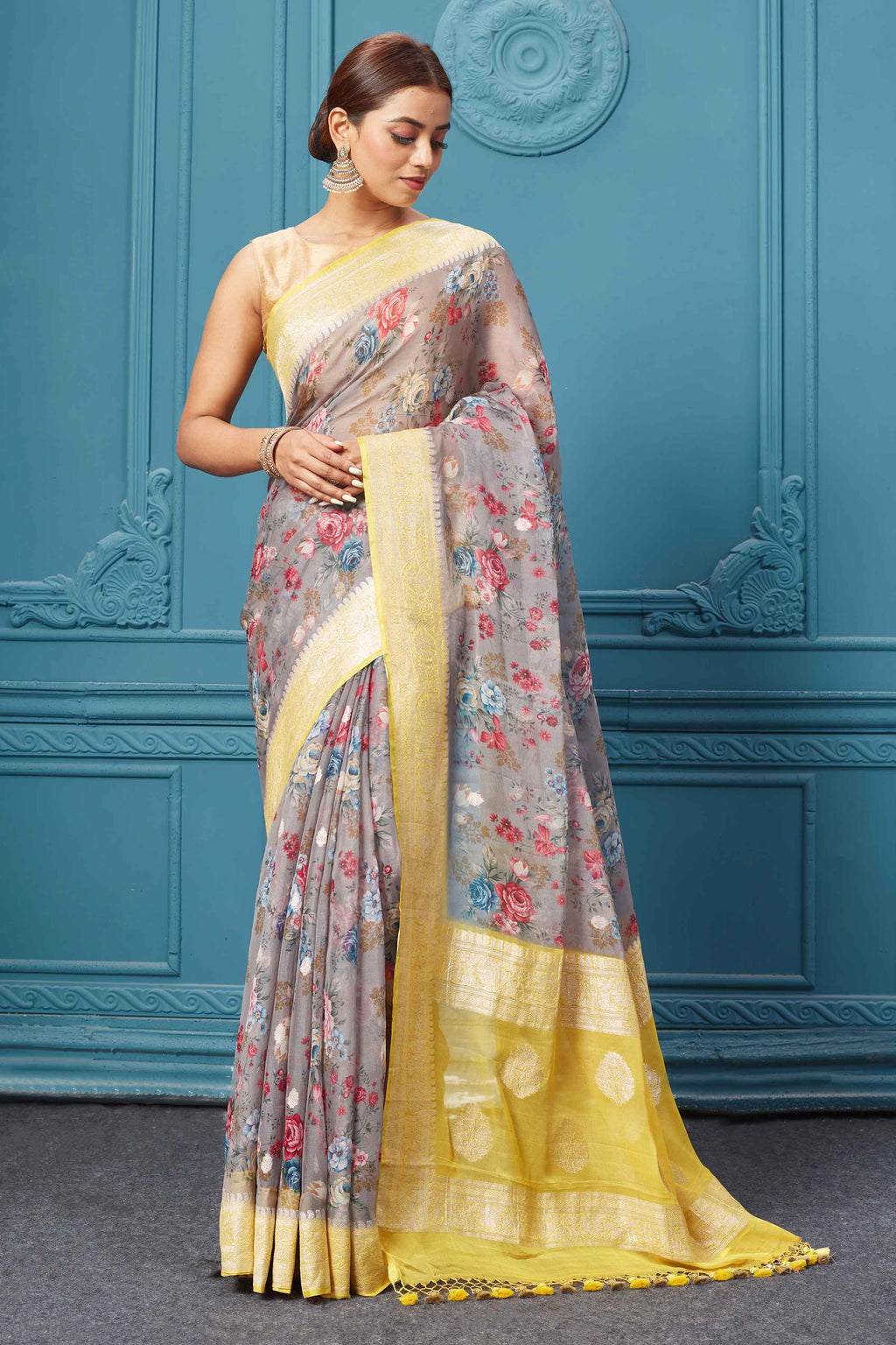 Buy grey floral print chiffon Banarasi sari online in USA with yellow zari border. Keep your ethnic wardrobe up to date with latest designer saris, pure silk sarees, Kanchipuram silk sarees, handwoven silk sarees, tussar silk sarees, embroidered sarees from Pure Elegance Indian saree store in USA.-full view