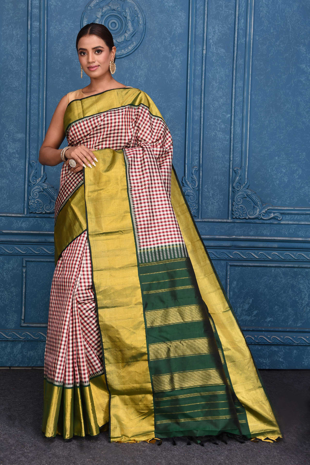 Buy cream and red check Kanchipuram silk sari online in USA with green zari border. Keep your ethnic wardrobe up to date with latest designer saris, pure silk sarees, Kanchipuram silk sarees, handwoven silk sarees, tussar silk sarees, embroidered sarees from Pure Elegance Indian saree store in USA.-full view