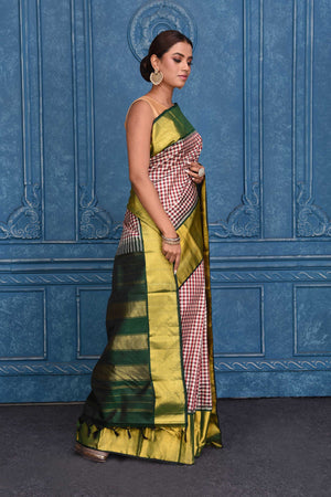 Buy cream and red check Kanchipuram silk sari online in USA with green zari border. Keep your ethnic wardrobe up to date with latest designer saris, pure silk sarees, Kanchipuram silk sarees, handwoven silk sarees, tussar silk sarees, embroidered sarees from Pure Elegance Indian saree store in USA.-side