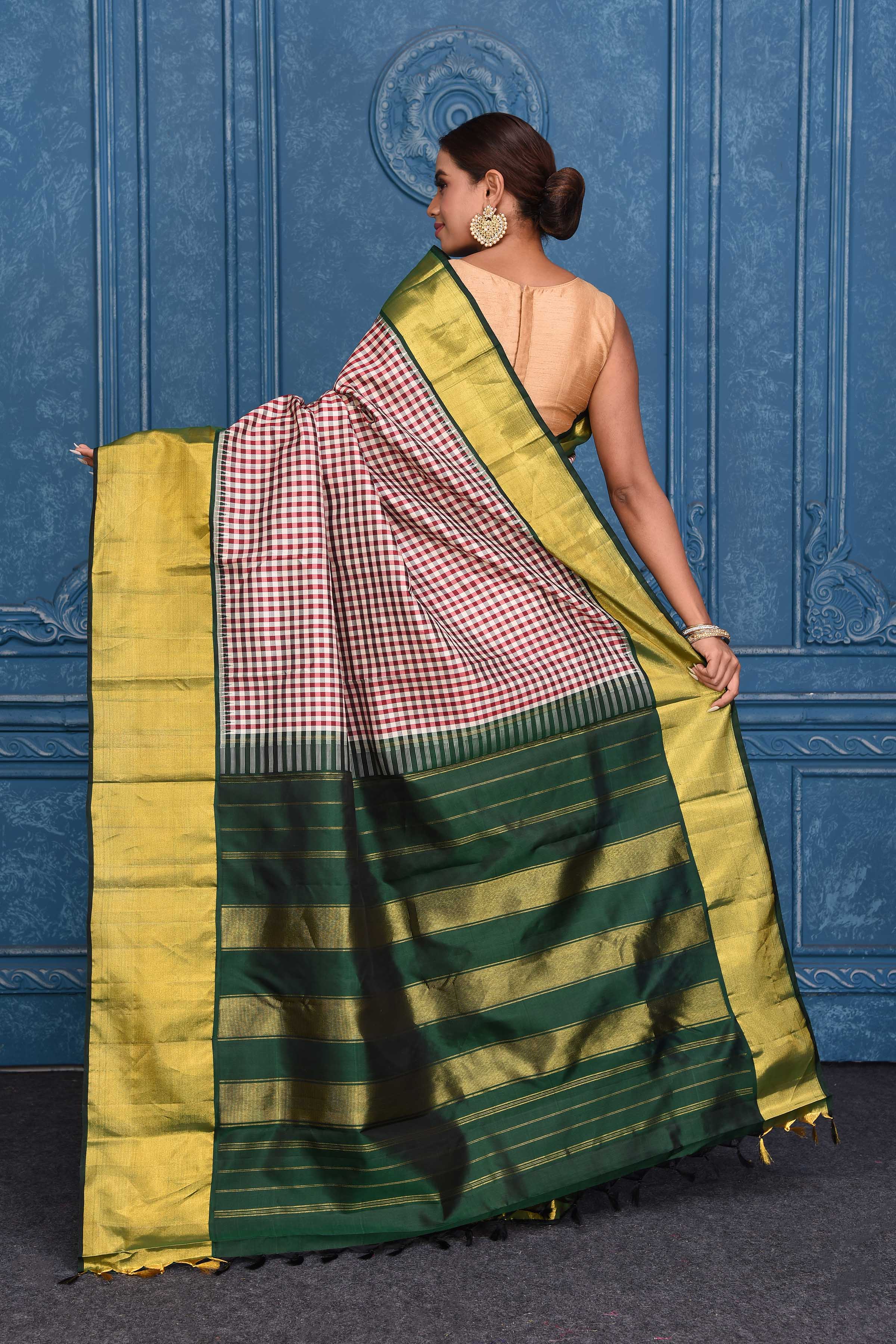 Buy cream and red check Kanchipuram silk sari online in USA with green zari border. Keep your ethnic wardrobe up to date with latest designer saris, pure silk sarees, Kanchipuram silk sarees, handwoven silk sarees, tussar silk sarees, embroidered sarees from Pure Elegance Indian saree store in USA.-back
