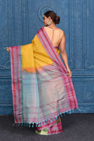 Buy yellow striped pure Gadhwal silk silk sari online in USA with bluish pink border. Keep your ethnic wardrobe up to date with latest designer saris, pure silk sarees, Kanchipuram silk sarees, handwoven silk sarees, tussar silk sarees, embroidered sarees from Pure Elegance Indian saree store in USA.-back