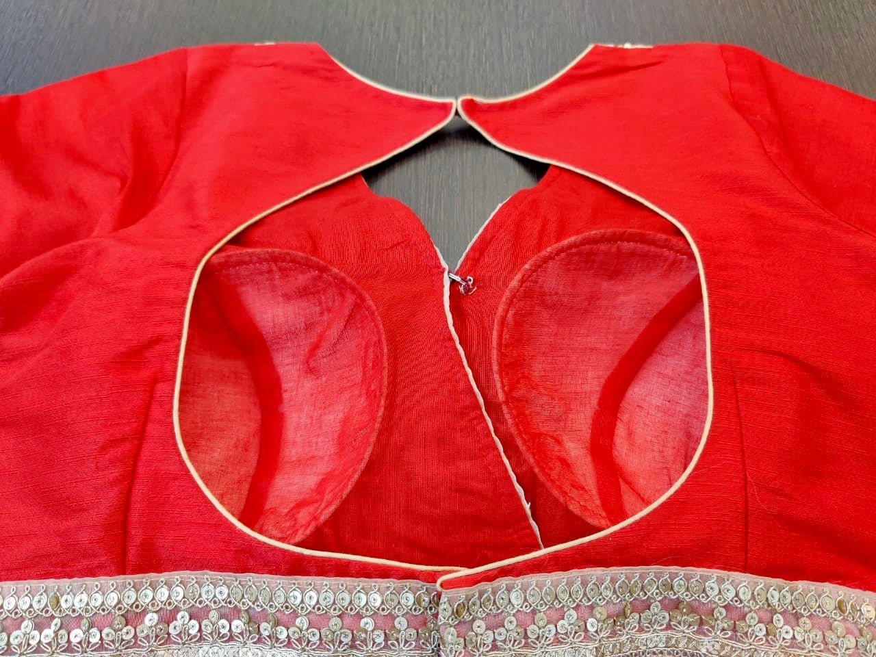 Buy stunning solid red designer saree blouse online in USA with embroidered lace. Elevate your ethnic sari style with a stunning collection of designer saree blouses, embroidered saree blouses, Banarasi sari blouse, silk sari blouse from Pure Elegance Indian clothing store in USA.-back