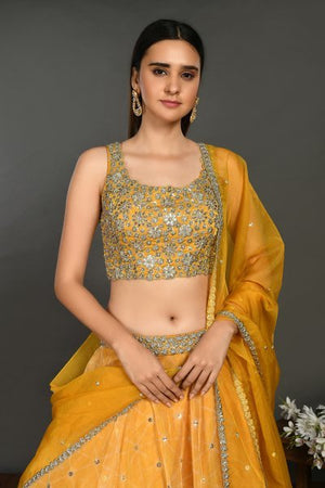Buy stunning yellow organza lehenga online in USA with dupatta. Get festive ready in beautiful designer Anarkali suits, designer lehenga, wedding gowns, sharara suits, designer sarees from Pure Elegance Indian fashion store in USA.-closeup
