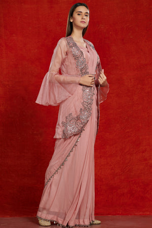 Buy beautiful blush pink fusion saree online in USA with attached jacket. Make a fashion statement on festive occasions and weddings with designer suits, Indian dresses, Anarkali suits, palazzo suits, designer gowns, sharara suits from Pure Elegance Indian fashion store in USA.-side