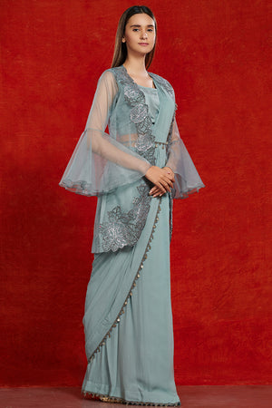 Shop beautiful doctor blue fusion saree online in USA with attached jacket. Make a fashion statement on festive occasions and weddings with designer suits, Indian dresses, Anarkali suits, palazzo suits, designer gowns, sharara suits from Pure Elegance Indian fashion store in USA.-side
