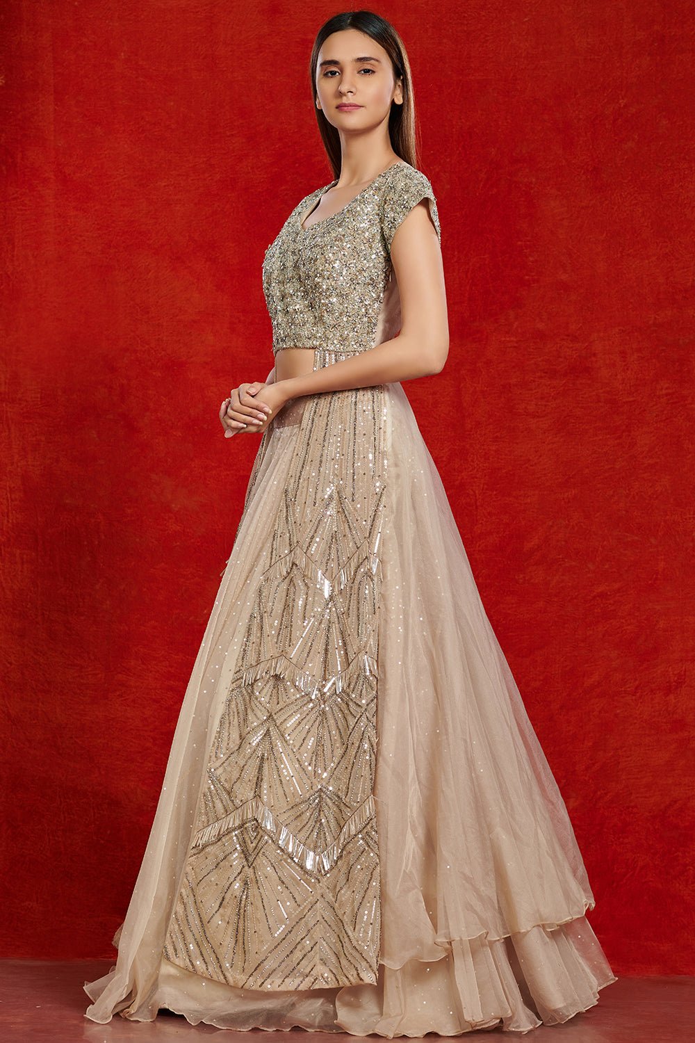 Buy stunning beige embellished lehenga online in USA. Make a fashion statement on festive occasions and weddings with designer suits, Indian dresses, Anarkali suits, palazzo suits, designer gowns, sharara suits from Pure Elegance Indian fashion store in USA.-left