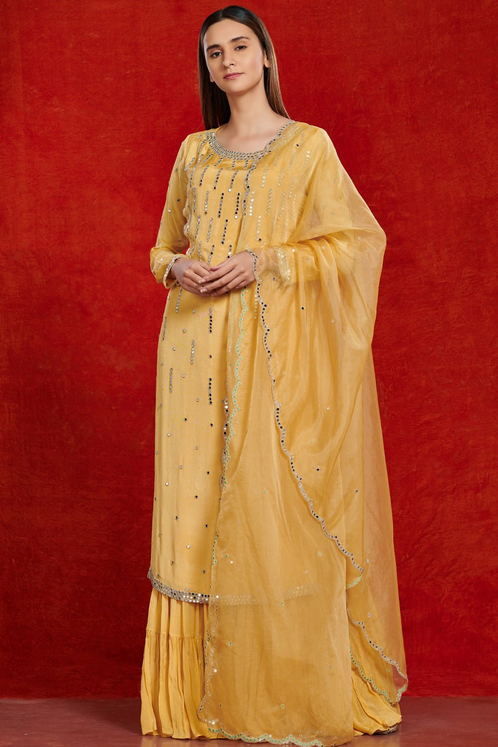 Shop stunning yellow mirror work chiffon sharara suit online in USA with dupatta. Make a fashion statement on festive occasions and weddings with palazzo suits, sharara suits, partywear dresses, salwar suits from Pure Elegance Indian fashion store in USA.-front