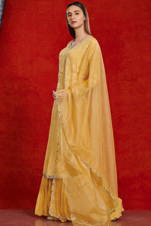 Shop stunning yellow mirror work chiffon sharara suit online in USA with dupatta. Make a fashion statement on festive occasions and weddings with palazzo suits, sharara suits, partywear dresses, salwar suits from Pure Elegance Indian fashion store in USA.-full view