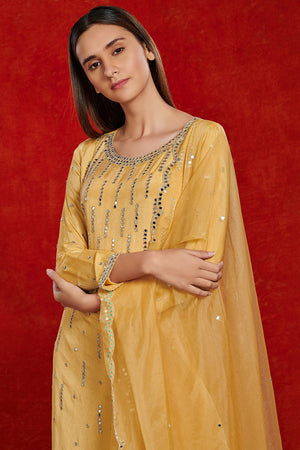Shop stunning yellow mirror work chiffon sharara suit online in USA with dupatta. Make a fashion statement on festive occasions and weddings with palazzo suits, sharara suits, partywear dresses, salwar suits from Pure Elegance Indian fashion store in USA.-closeup