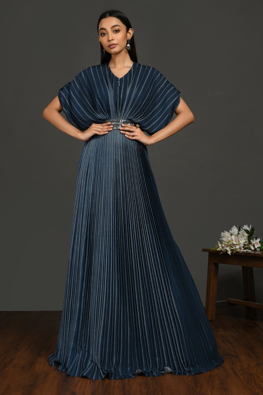 Buy beautiful satin gown pleated gown online in USA with metallic belt. Make a fashion statement on festive occasions and weddings with designer suits, Indian dresses, Anarkali suits, palazzo suits, designer gowns, sharara suits from Pure Elegance Indian fashion store in USA.-front
