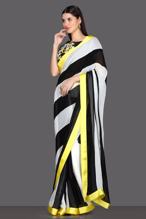 Shop elegant black and white striped saree online in USA with embroidered saree blouse. Make a fashion statement at parties with stunning designer sarees from Pure Elegance Indian fashion store in USA.-side