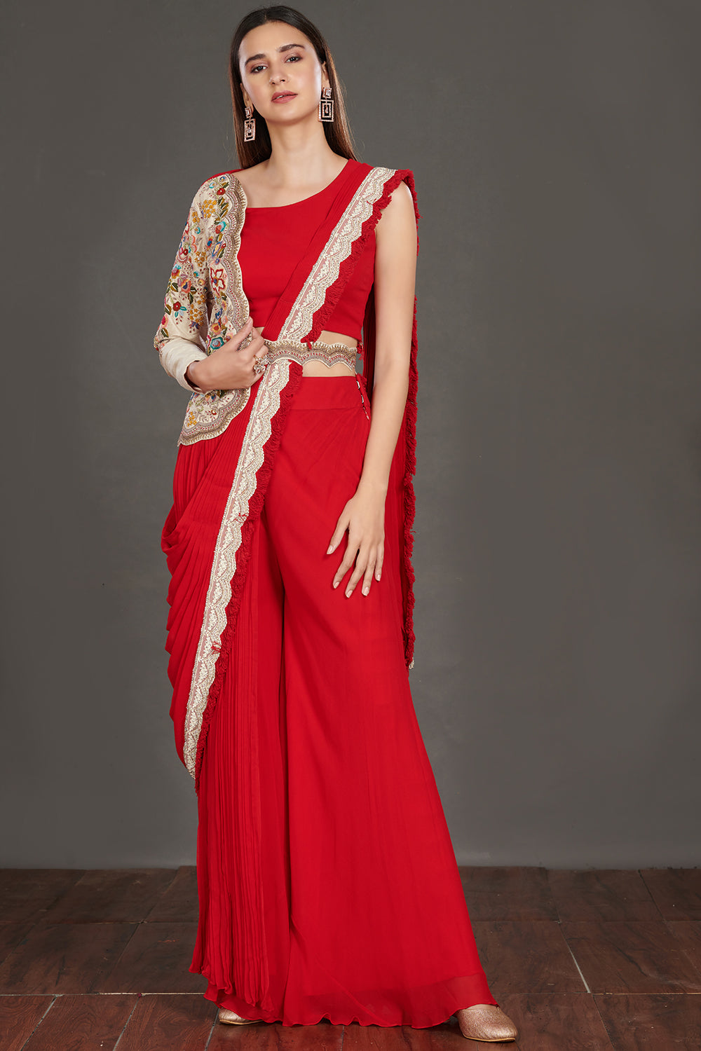 Buy stunning red pant saree online in USA with one sided embroidered jacket. Make a fashion statement on festive occasions and weddings with designer suits, Indian dresses, Anarkali suits, palazzo suits, designer gowns, sharara suits from Pure Elegance Indian fashion store in USA.-full view
