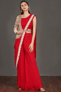  Buy stunning red pant saree online in USA with one sided embroidered jacket. Make a fashion statement on festive occasions and weddings with designer suits, Indian dresses, Anarkali suits, palazzo suits, designer gowns, sharara suits from Pure Elegance Indian fashion store in USA.-full view