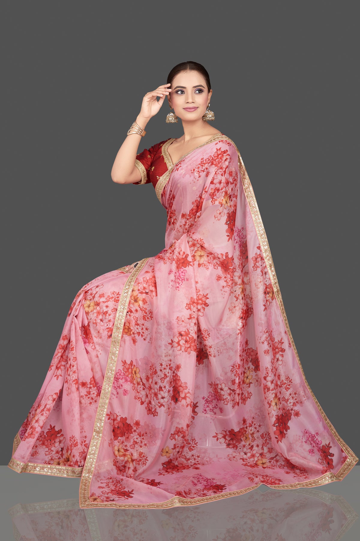 Shop beautiful pink embroidered floral organza saree saree online in USA with red saree blouse. Look glamorous at parties and weddings in stunning designer sarees, embroidered sareees, fancy sarees, Bollywood sarees from Pure Elegance Indian saree store in USA.-full view