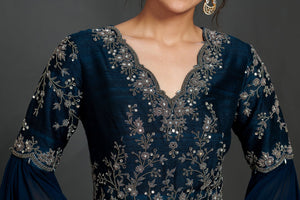 Shop stunning teal blue embroidered fit and flare gown online in USA  Make a fashion statement on festive occasions and weddings with designer suits, Indian dresses, Anarkali suits, palazzo suits, designer gowns, sharara suits from Pure Elegance Indian fashion store in USA.-neckline