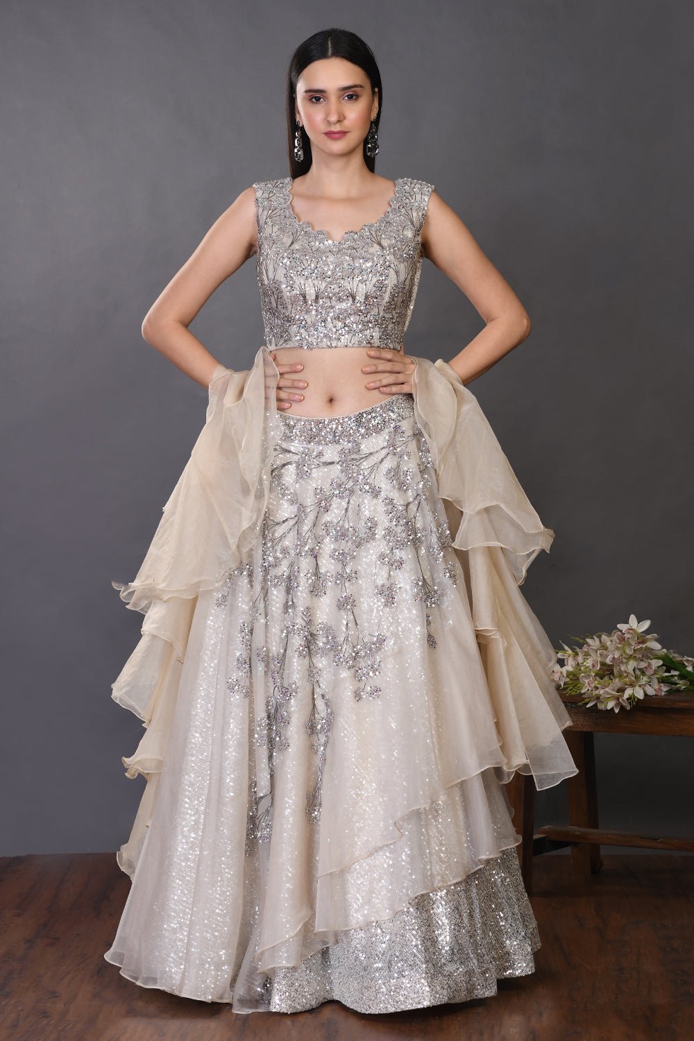 Shop beautiful off-white organza lehenga online in USA with ruffle dupatta. Get festive ready in beautiful designer Anarkali suits, designer lehenga, wedding gowns, sharara suits, designer sarees from Pure Elegance Indian fashion store in USA.-full view